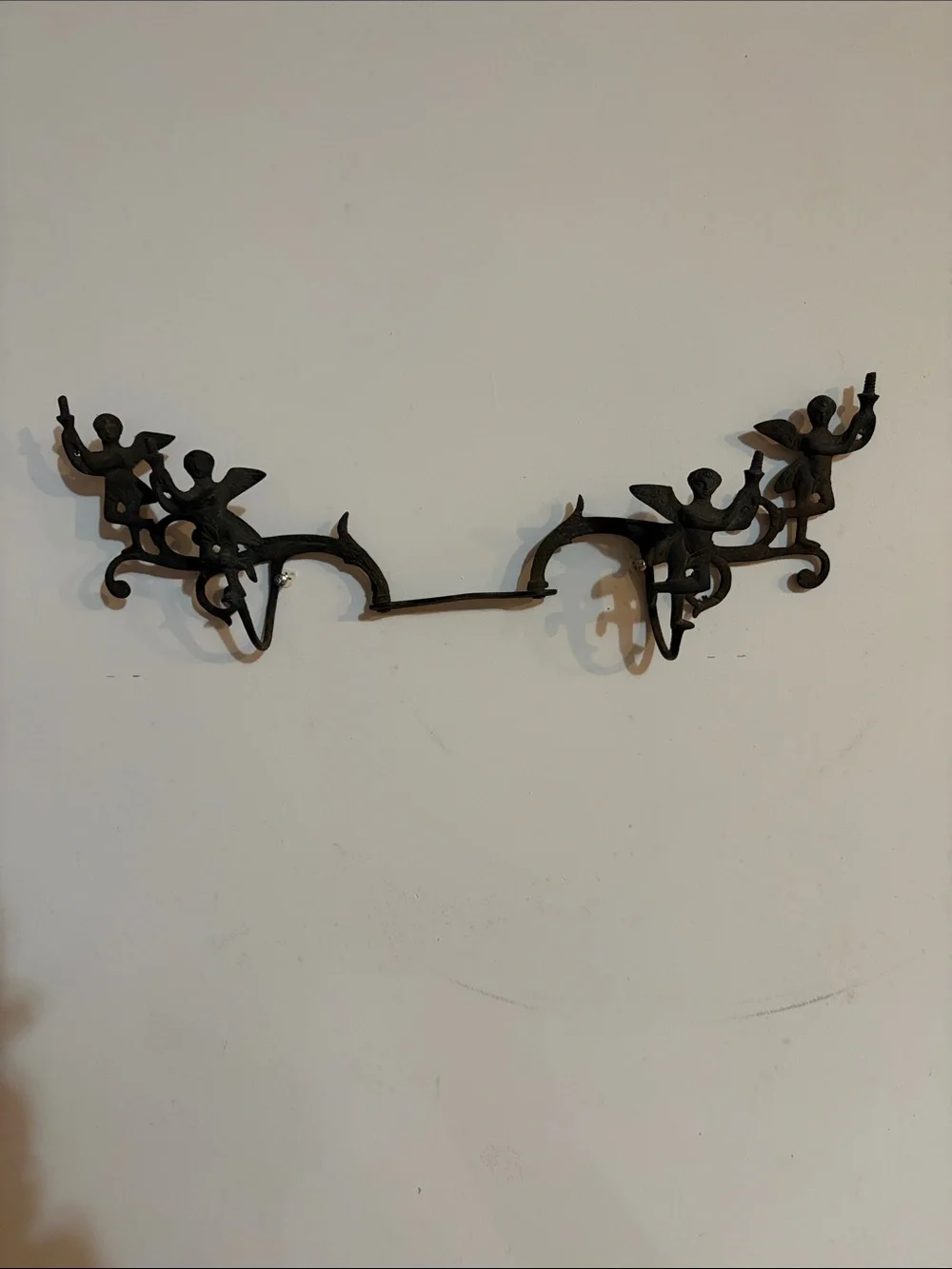 Cast iron coat rack with Cherubs. Mid century or earlier?